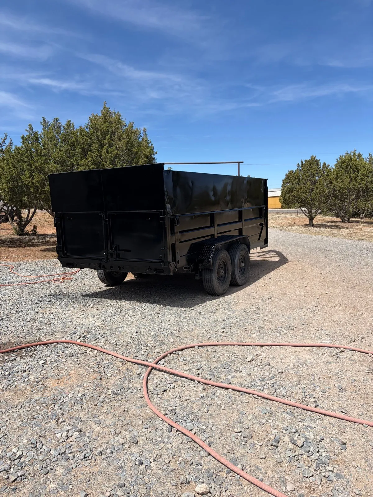 The same dump trailer re-coated in black.
